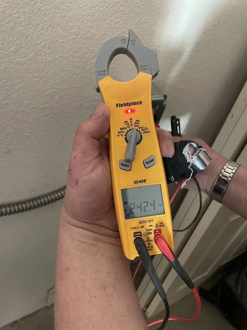 Voltage testing with clamp meter during Generator Installation in Costa Mesa